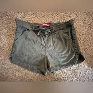 Army, green shorts with front pockets and back pockets- back pockets are fake
